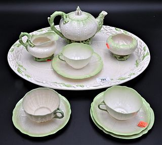 11 Piece Belleek Echinus Tea Set, to include tray, sugar, creamer, teapot, 3 cups, 4 saucers, green and white coral design, black mark on bottom; tall
