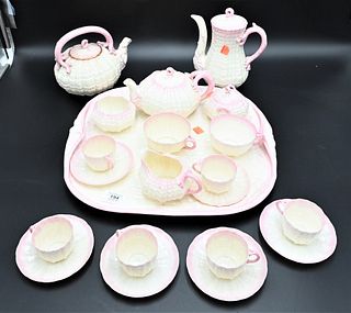 21 Piece Belleek Porcelain Pink Shell and Coral Form Tea Set, to include 3 teapots, sugar, creamer, covered sugar, cups, saucers, along with a large t
