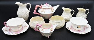 Six Piece Belleek Thornberry Pink Set, pink with black mark; along with five piece creamer and sugar set having black mark, tallest 4 1/2 inches. Prov