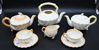 Two Belleek Neptune Tea Sets, to include one six piece with painted brown border, with black mark, (repaired cover); along with a two piece light yell