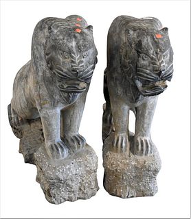 Pair of Carved Stone Cats, on carved bases, one tail broken off but available, height 32 inches, length 36 inches.