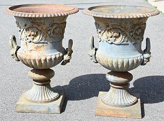 Pair of Iron Urns, having handles, on square footed bases, height 30 inches, inside diameter 18 1/2 inches.