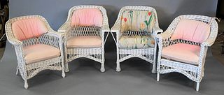 Group of Four Vintage Wicker Armchairs, to include cushions, (faded and soiled). Provenance: An estate from Redding, CT.