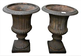 Pair of Victorian Iron Urns, height 19 inches, inside diameter 11 1/2 inches.