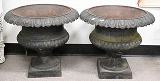 Pair of Victorian Iron Urns, height 18 inches, opening diameter 15 inches.