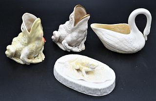 Four Belleek Animals, to include three frogs along with a swan; all with black marks; tallest frog 4 3/4 inches. Provenance: Collections of Norma Reil