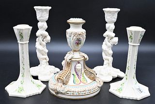 Five Belleek Candlesticks, to include two pairs of Belleek candlesticks; a pair of painted sticks, not marked; a pair of figural candlesticks with bla