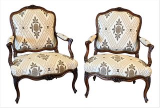 Pair of Nogaret Lyon Louis XV Walnut Fauteuil, ribbon carved and fluted backs and frames, set on carved cabriole legs, signed Nogaret Lyon, Monsieur D