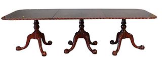 Reproduction Mahogany Triple Pedestal Dining Table, having rope edge top over carved pedestals with ball and claw feet, having two 20 inch leaves, lat