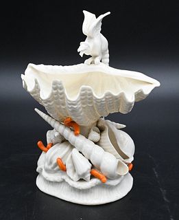 Belleek Winged Griffin, on shell resting on shells, orange painted coral, black mark on bottom, height 7 1/2 inches. Provenance: Collections of Norma 