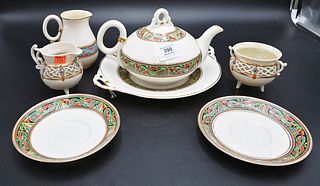Partial Belleek Celtic Tea Set, teapot and underplate having black mark; two saucers having green mark; along with a two piece creamer and sugar set, 