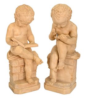 Pair of Carved Marble Figures, boy and a girl sitting on a stone wall reading and writing, 19th century or earlier, (both repaired), height 27 inches,