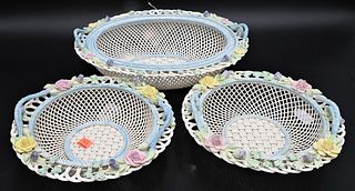 Three Belleek Baskets, having painted flowers and twig handles, large oval with brown mark, pair of round with impressed mark; length 12 inches, heigh