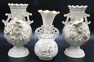 Group of Three Belleek Vases, to include pair having bird and encrusted flowers, heights 10 inches; along with a smaller vase with flared rim and encr