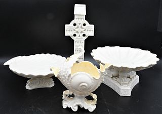 Four Piece Belleek Porcelain Group, to include a tri-dolphin porcelain compote with shell form top on dolphin tri-foot base (repaired); along with a s