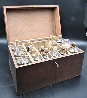 Apothecary Box, having lift top opening to glass bottle and decanters, height 9 inches, top 15" x 9 1/4". Provenance: Estate of Florence Yannios, Ches