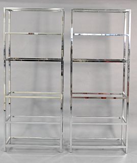 Pair of Mid Century Chrome Etageres, each having six glass shelves, height 79 inches, width 32 inches, depth 12 1/4 inches.