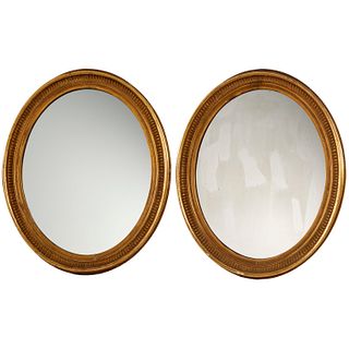 Pair George III giltwood oval mirrors