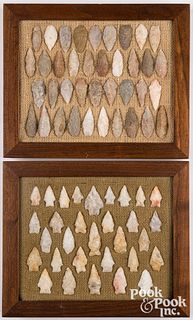 Two wood frames, containing stone points