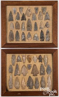 Two wood frames containing flint points