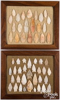 Two wood frames containing ancient points