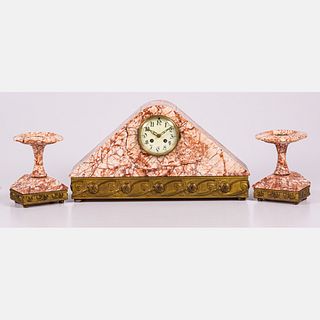 An Art Nouveau Rouge Marble and Brass Three Piece Clock Garniture Set