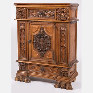 An Italian Renaissance Style Carved Wood Cabinet