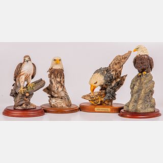 A Group of Four Composite and Porcelain Statues of Eagles and a Hawk