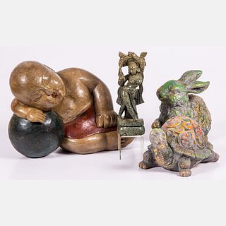 A Collection of Asian Ceramic, Stone and Carved Wood Decorations