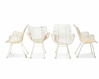A set of mid-century modern wire mesh outdoor chairs