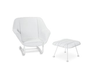 A mid-century modern wire mesh outdoor chair and ottoman