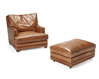 A leather club chair and ottoman