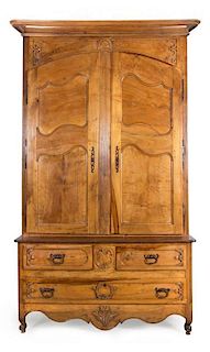 A French Provincial Carved Fruitwood Pantalooniere Height 105 x width 60 3/4 x depth 21 inches.