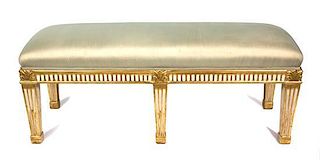 A Neoclassical Style Painted and Parcel Gilt Bench Height 20 x length 54 x depth 18 inches.
