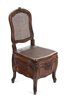 A French Provincial Carved Walnut Chair Height 37 1/2 inches.