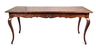 A Louis XV Provincial Style Walnut Library Table Height 30 x length 71 x depth 28 1/4 inches.