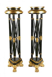 A Pair of Regency Style Parcel Gilt Torchere Stands Height 53 1/2 x diameter 14 1/2 inches.