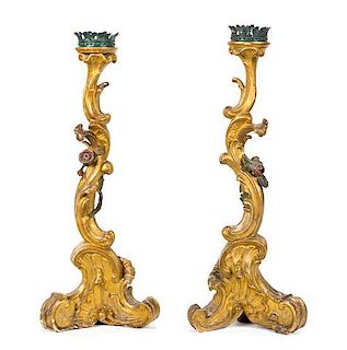 A Pair of Italian Rococo Carved and Parcel Gilt Candlesticks Height 28 3/4 inches.