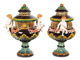 A Pair of Majolica Covered Urns Height 24 inches.