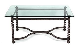A Wrought Iron Glass Top Coffee Table Height 17 1/2 x width 40 x depth 30 1/4 inches.