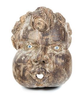 A Folk-Art Carved Pine Face of Anemoi, God of the North Wind Height 16 x width 14 inches.