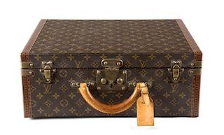 A Louis Vuitton Monogram Canvas Hardsided Suitcase Height 14 x width 17 1/2 x depth 6 7/8 inches.