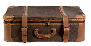 A Louis Vuitton Leather Soft-Sided Suitcase Height 9 x width 27 1/2 x depth 18 inches.