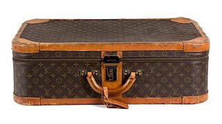 A Louis Vuitton Leather Suitcase Height 25 x width 23 inches.