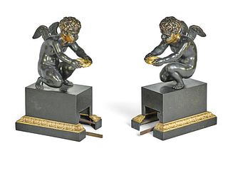 A PAIR OF PATINATED & GILT BRONZE FIGURAL FIRE FENDER