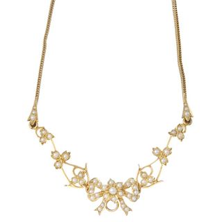 An early 20th century gold seed pearl floral necklace. Of openwork design, the seed and split pearl