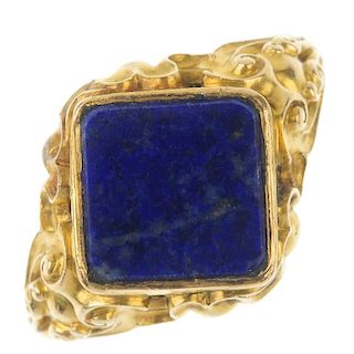 An early 20th century lapis lazuli ring. The replacement square-shape lapis lazuli, to the scrolling