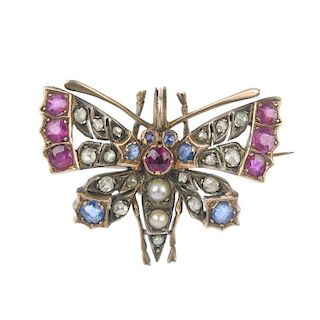 A late 19th century silver and gold diamond, ruby, sapphire and split pearl butterfly brooch. The sp