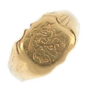 A late 19th century 18ct gold signet ring. The engraved initial monogram, to the tapered shoulders w