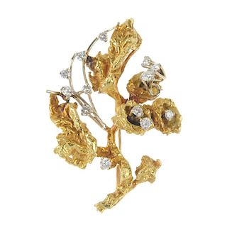 A 1960s 18ct gold diamond floral spray brooch. Designed as a series of scattered brilliant-cut diamo